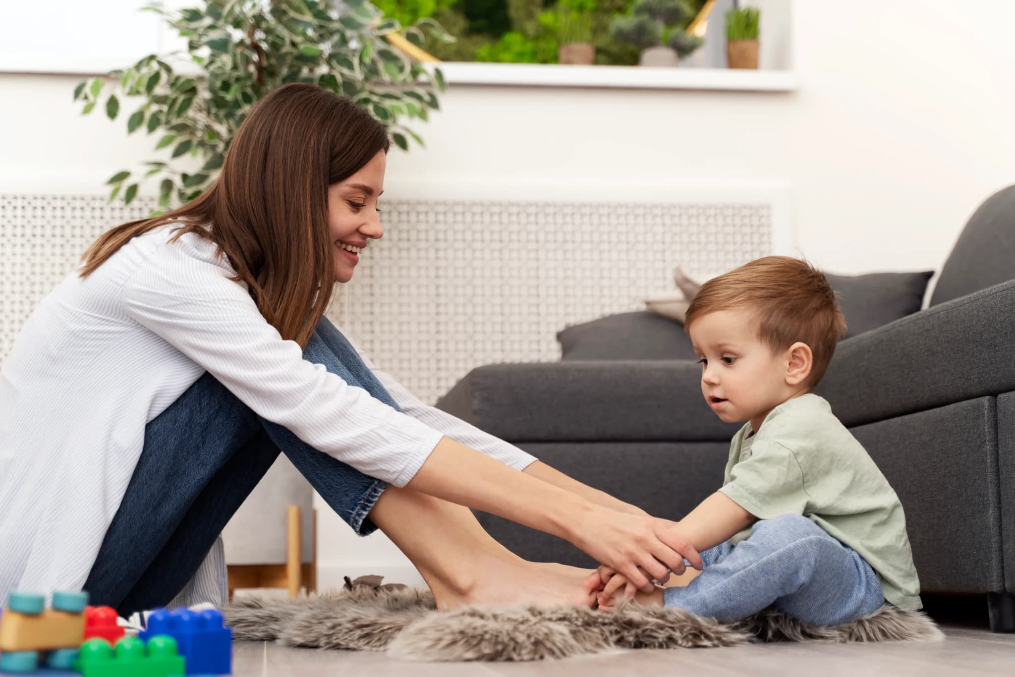 After-school caregiver helping child with homework