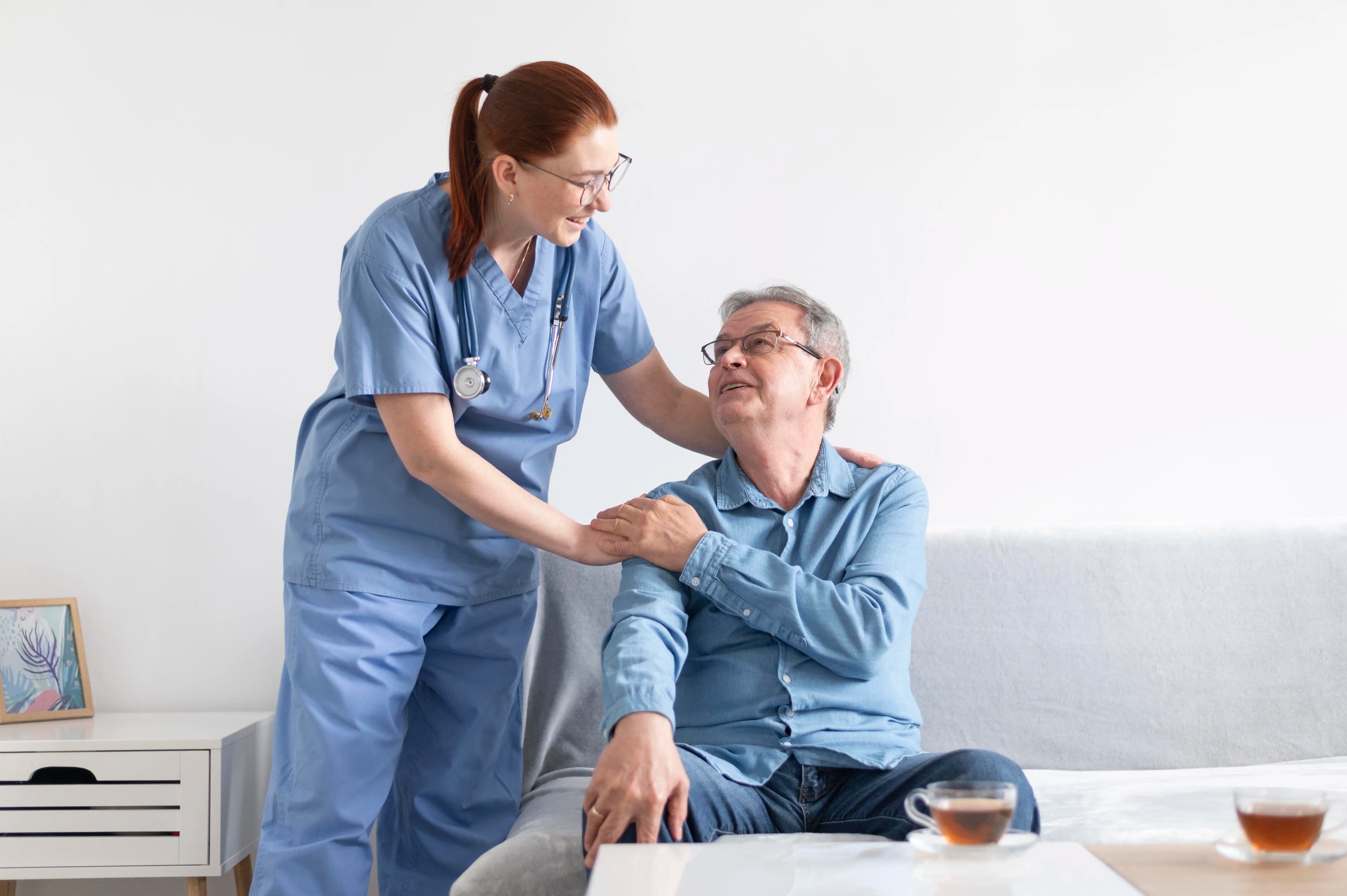 Caregiver assisting elderly patient with daily activities