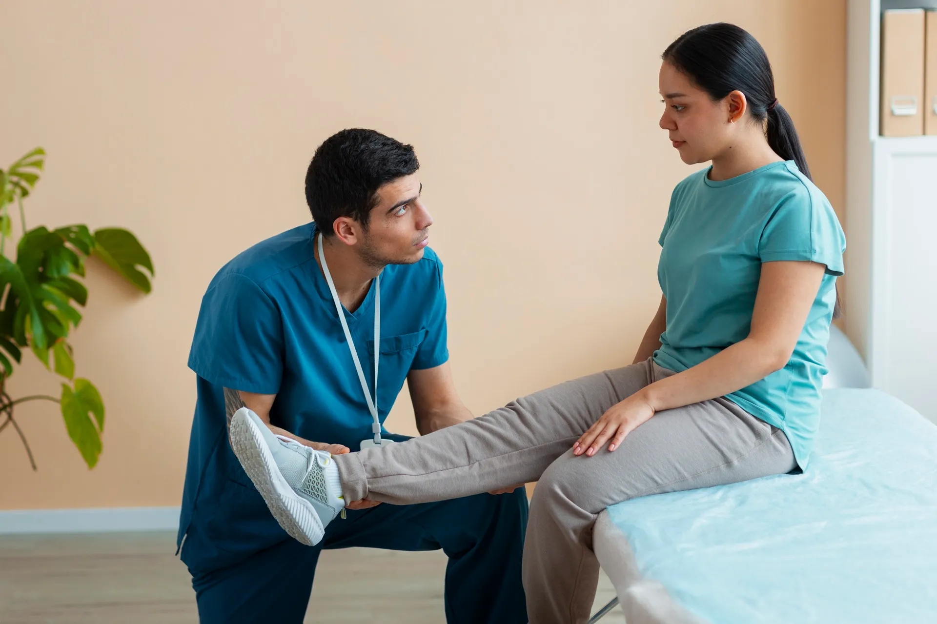 Caregiver helping elderly patient with mobility and daily activities