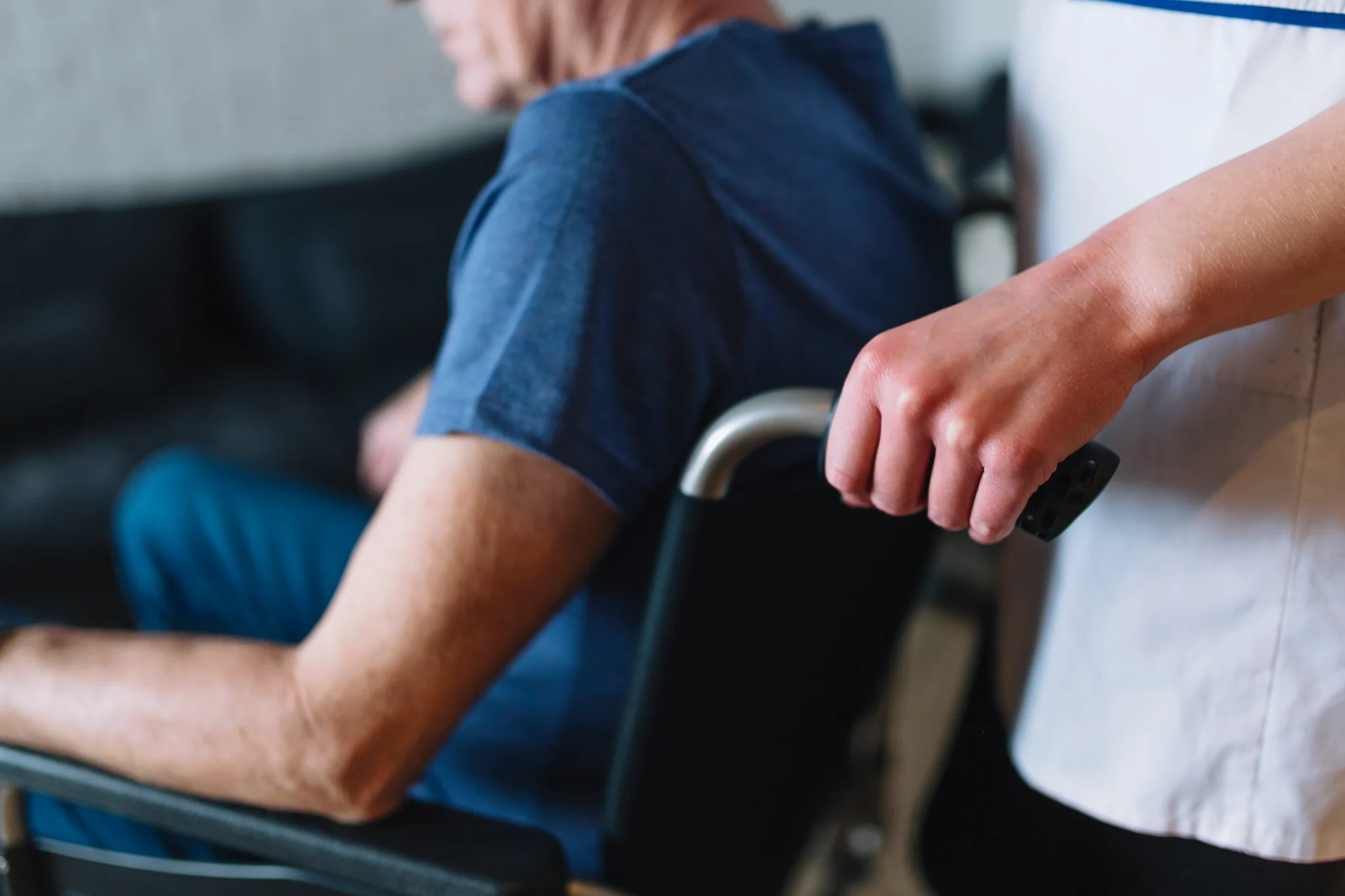 Personal care aide assisting senior with daily grooming